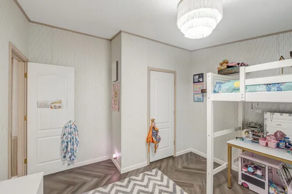 a room with furniture and wooden floor