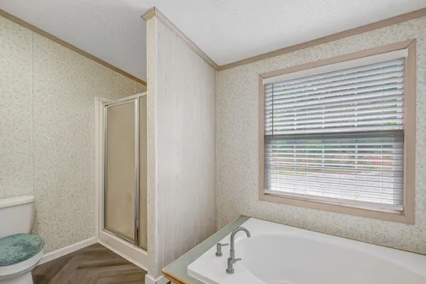 a view of a wooden deck with a big yard