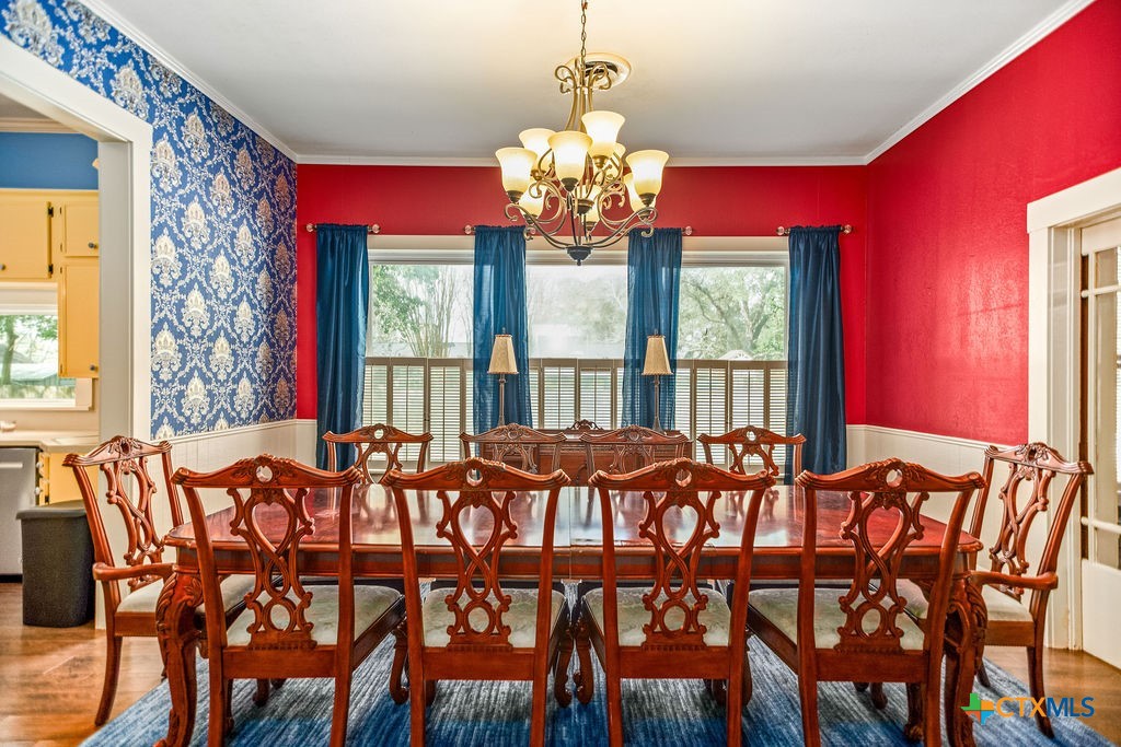 407 Robinson Street Edna, TX 77957 - Photo 13 of 41 a view of a dining room with furniture and window