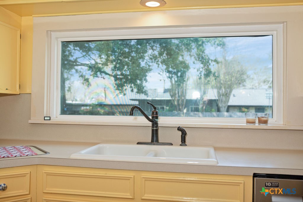 407 Robinson Street Edna, TX 77957 - Photo 16 of 41 a view of a sink and a window