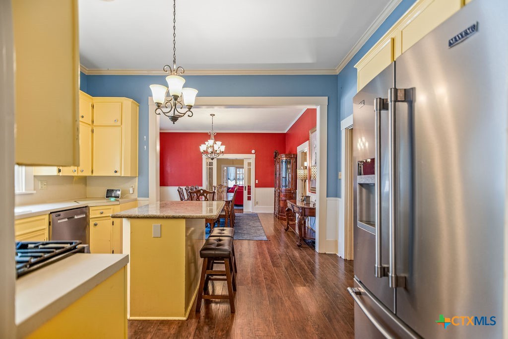 407 Robinson Street Edna, TX 77957 - Photo 18 of 41 a kitchen with sink refrigerator and window
