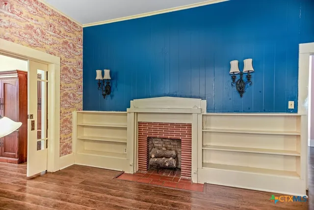 a view of kitchen with wooden floor and staircase
