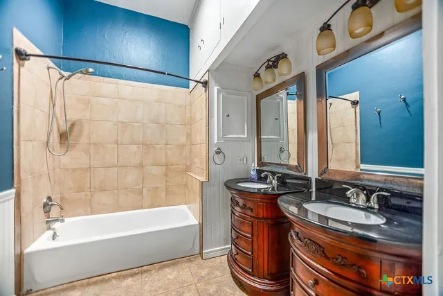 a bathroom with a sink and a bathtub