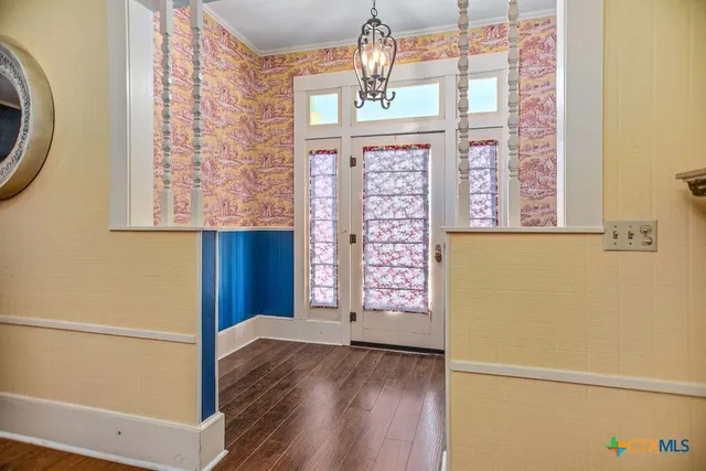 a view of front door with wooden floor