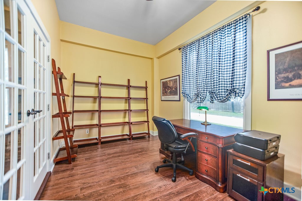 407 Robinson Street Edna, TX 77957 - Photo 5 of 41 a view of a workspace with furniture and a window