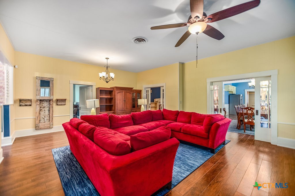 407 Robinson Street Edna, TX 77957 - Photo 6 of 41 a living room with furniture a ceiling fan and a rug