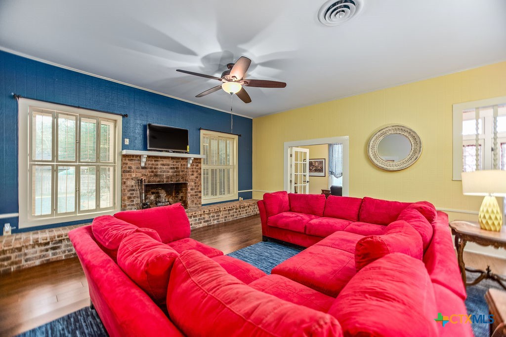 407 Robinson Street Edna, TX 77957 - Photo 9 of 41 a living room with furniture and a fireplace