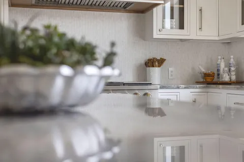 a kitchen with a sink and cabinets