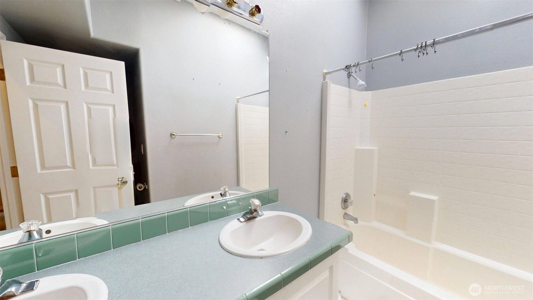 142 Fletcher Road Oroville, WA 98844 - Photo 13 of 26 a bathroom with a granite countertop sink and a mirror