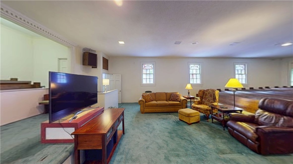 415 Church Street Pendleton, SC 29670 - Photo 13 of 35 Ample living space with recessed lighting and distinct arched windows creates a welcoming atmosphere.