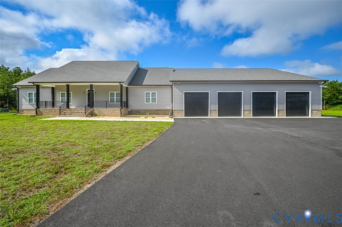 4141 Charles City Road Henrico, VA 23231 - Photo 1 of 35 a front view of a house with a garden and yard