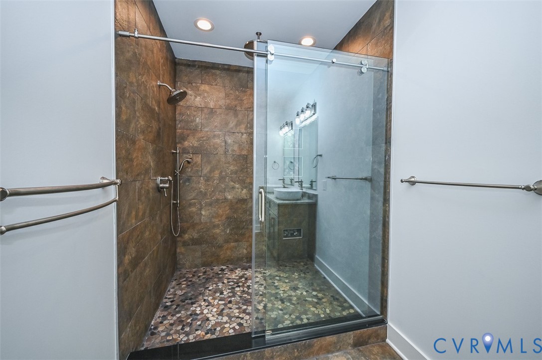 4141 Charles City Road Henrico, VA 23231 - Photo 19 of 35 a bathroom with a shower and a sink