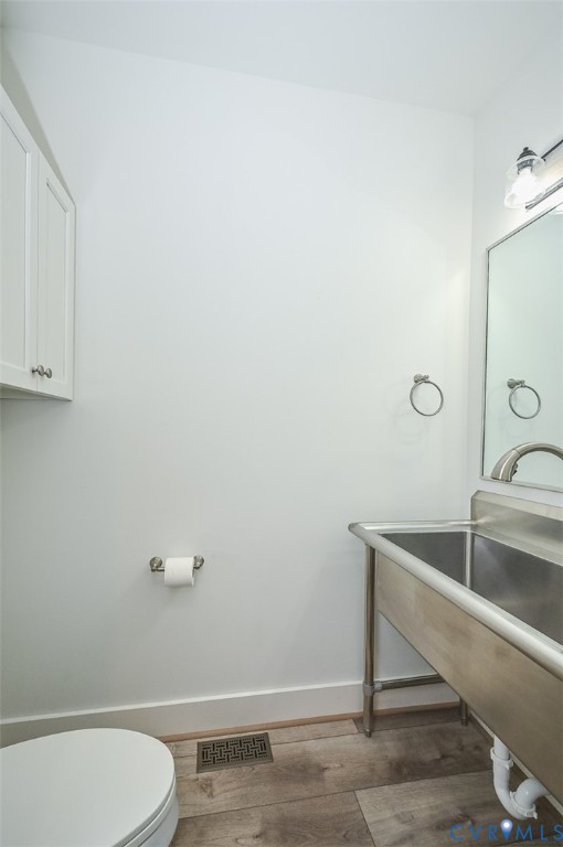 4141 Charles City Road Henrico, VA 23231 - Photo 21 of 35 a bathroom with a sink and toilet