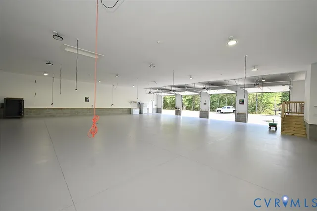 a view of a kitchen with a sink and a window
