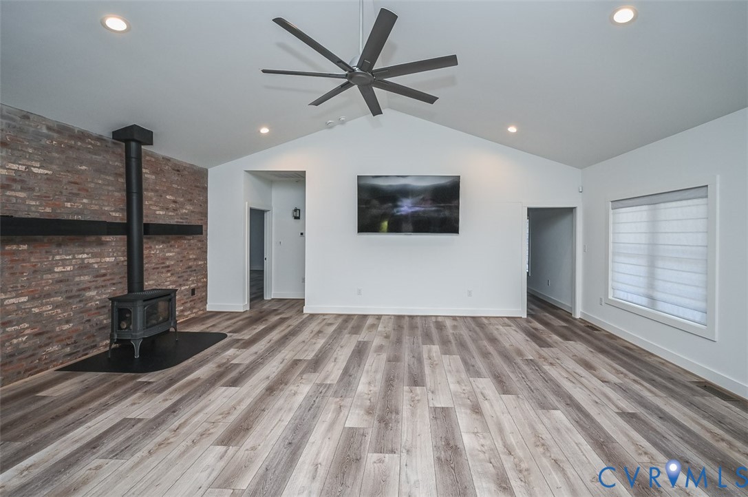 4141 Charles City Road Henrico, VA 23231 - Photo 6 of 35 a view of a livingroom with a flat screen tv ceiling fan and window
