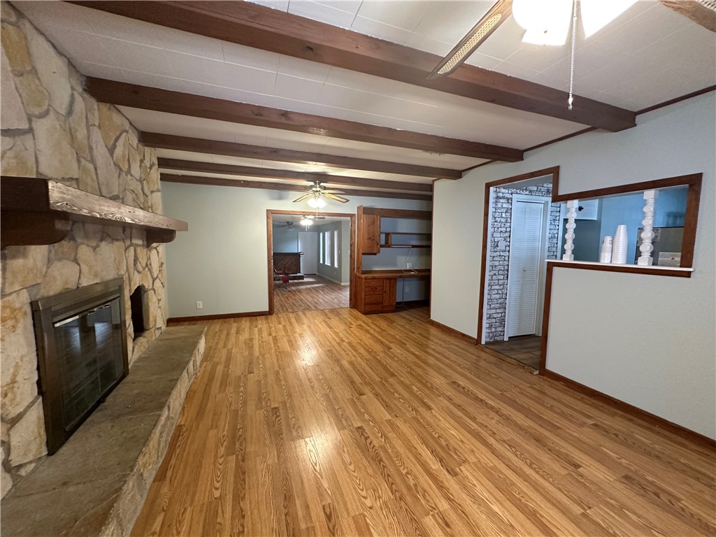 1608 Austin Street Portland, TX 78374 - Photo 14 of 24 a view of empty room with wooden floor and fireplace