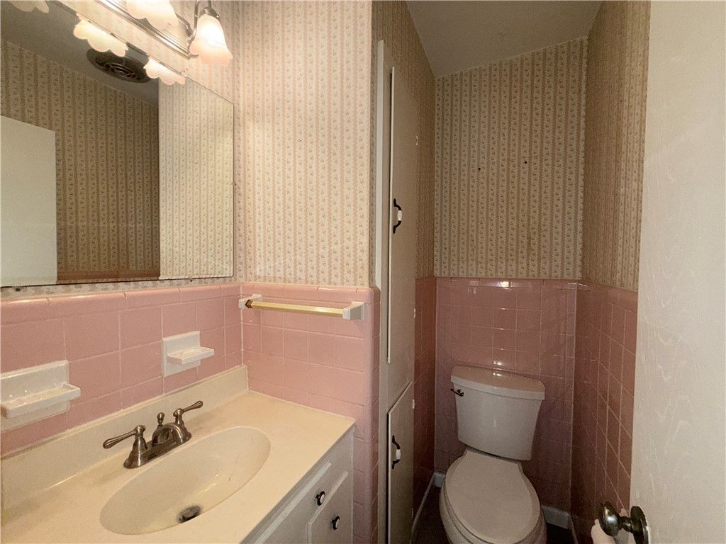 1608 Austin Street Portland, TX 78374 - Photo 21 of 24 a bathroom with a sink toilet and shower