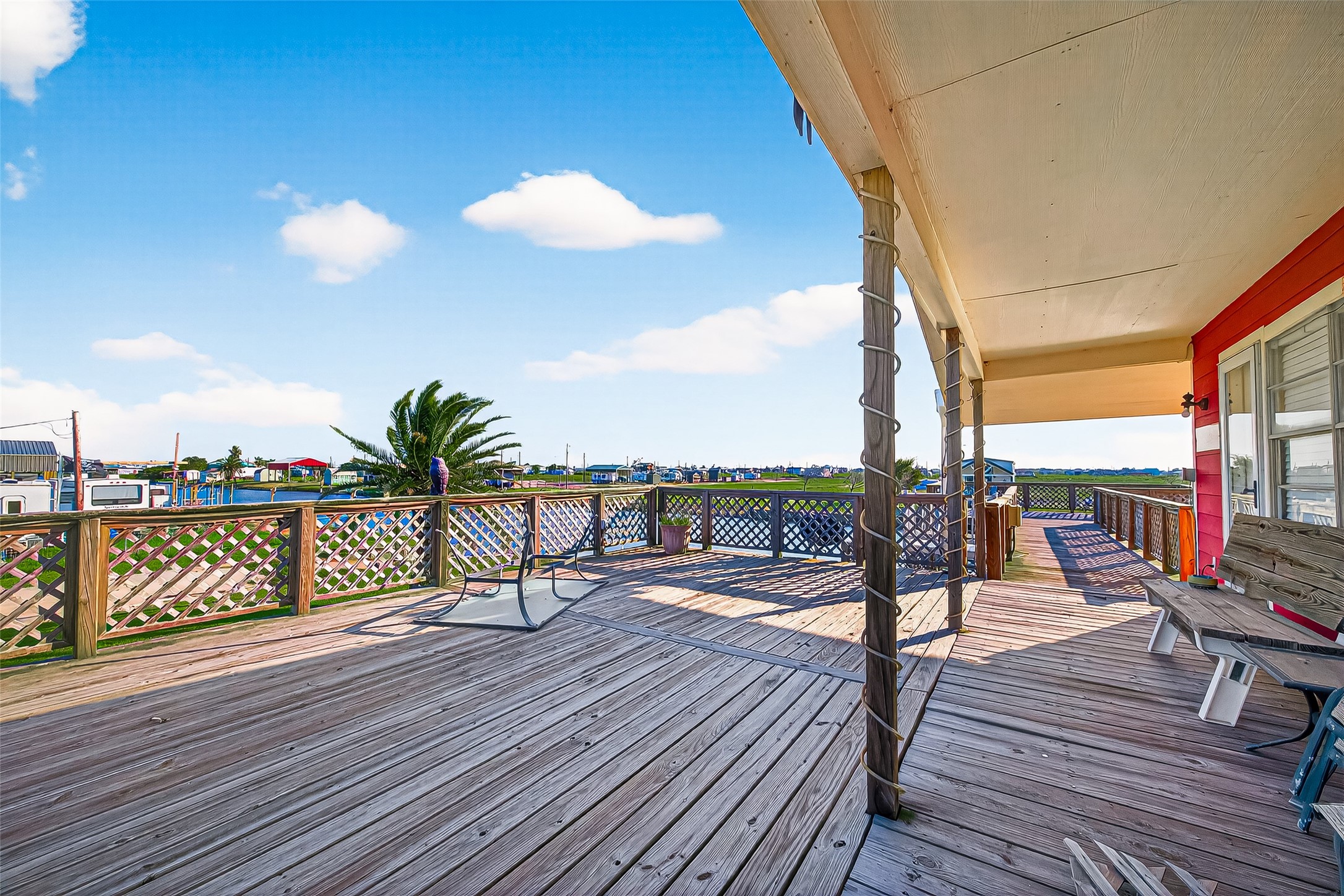 1870 Hall Road Sargent, TX 77414 - Photo 15 of 50 a view of a balcony with chairs and wooden floor