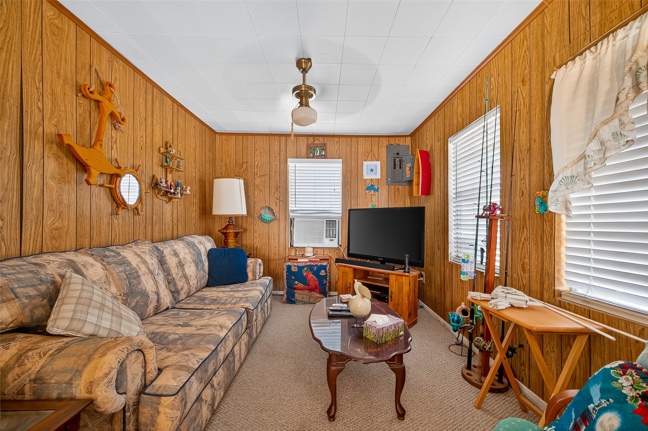 1870 Hall Road Sargent, TX 77414 - Photo 23 of 50 a living room with furniture and a flat screen tv