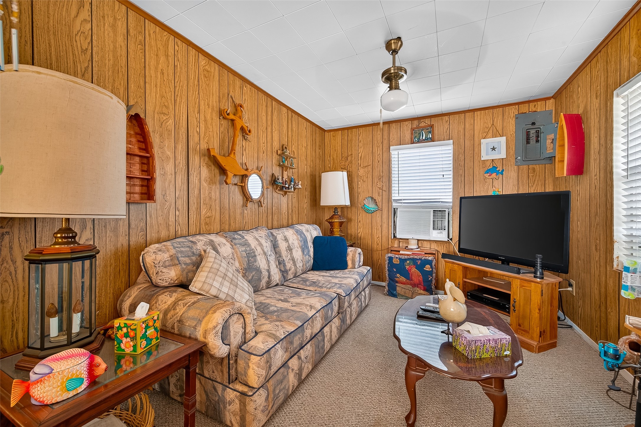 1870 Hall Road Sargent, TX 77414 - Photo 24 of 50 a living room with furniture and a flat screen tv