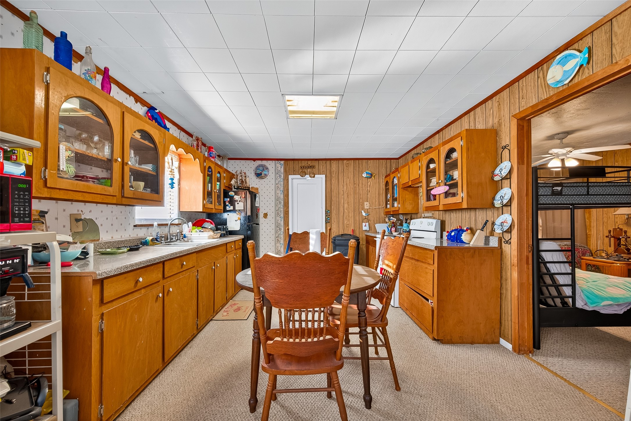 1870 Hall Road Sargent, TX 77414 - Photo 26 of 50 a dining room with furniture and a floor to ceiling window