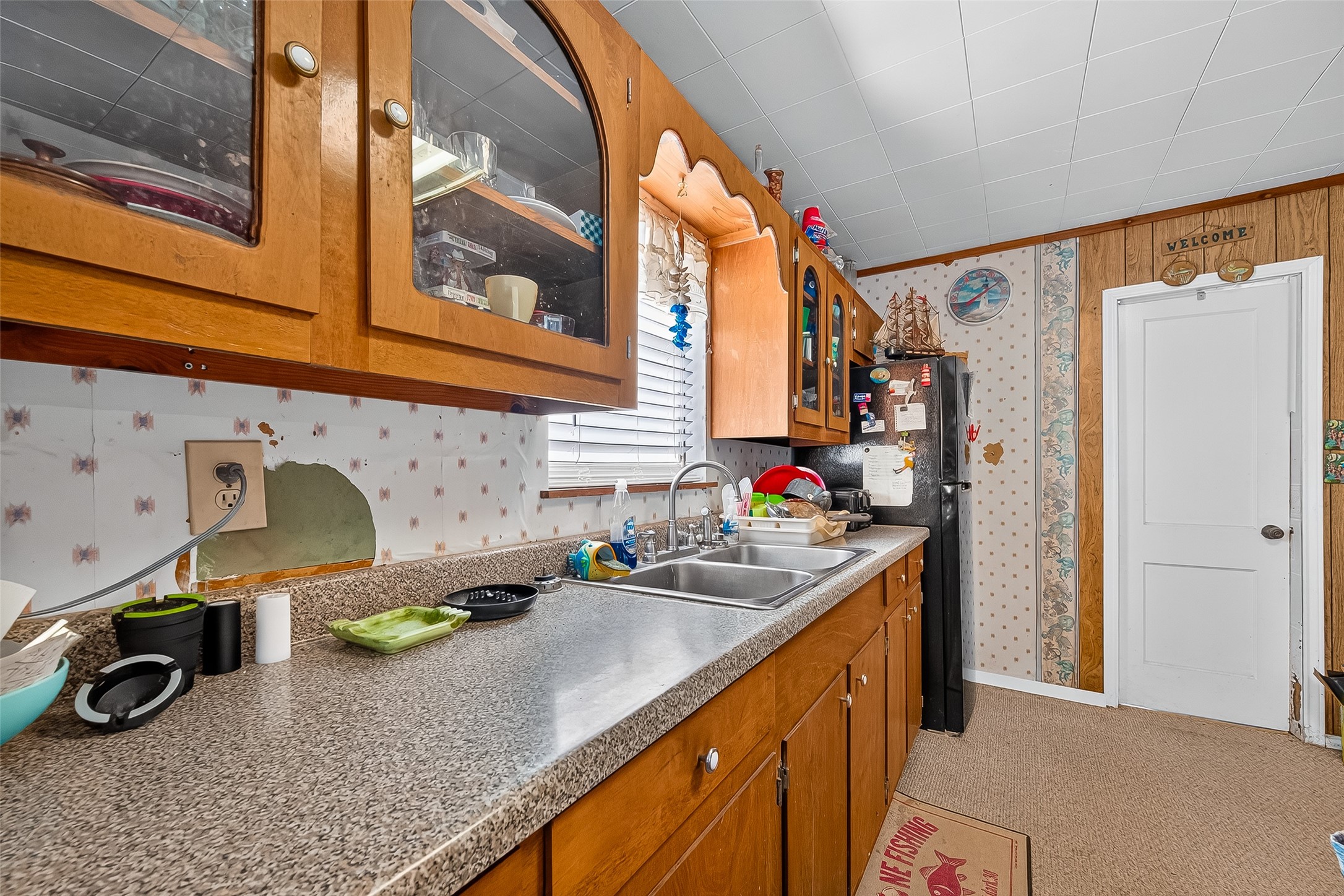 1870 Hall Road Sargent, TX 77414 - Photo 29 of 50 a kitchen with a sink a stove and cabinets