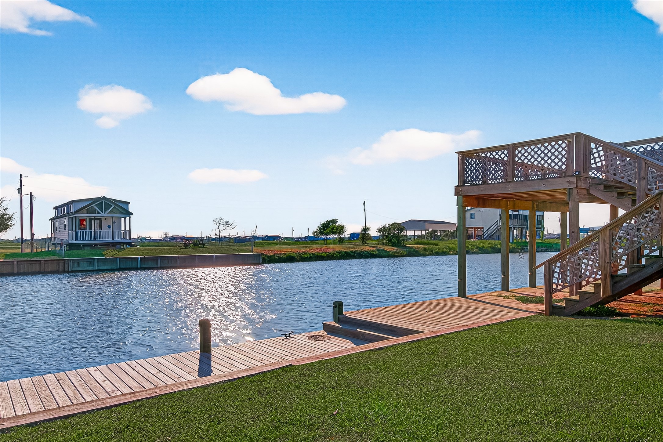 1870 Hall Road Sargent, TX 77414 - Photo 40 of 50 a view of a lake with a building in the background