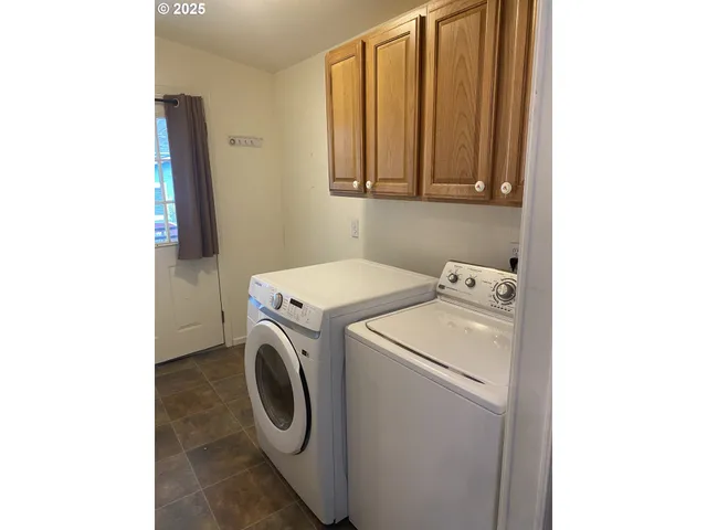 a bathroom with a tub and shower