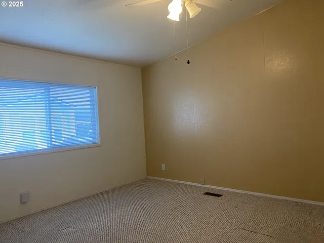 an empty room with a bathroom