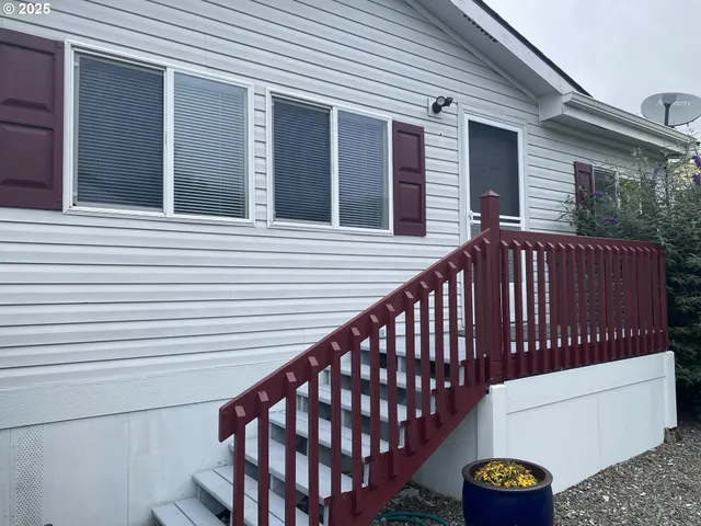 a view of a deck with wooden floor and a ceiling fan