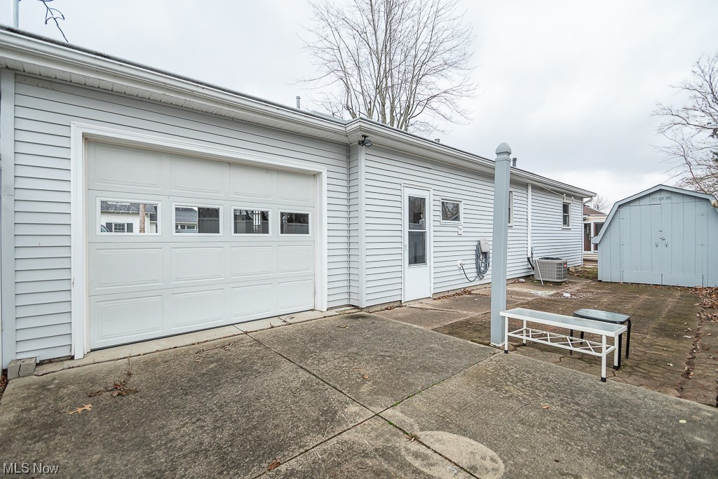 5 Pleasantview Vermilion, OH 44089 - Photo 26 of 37 Garage featuring central AC unit