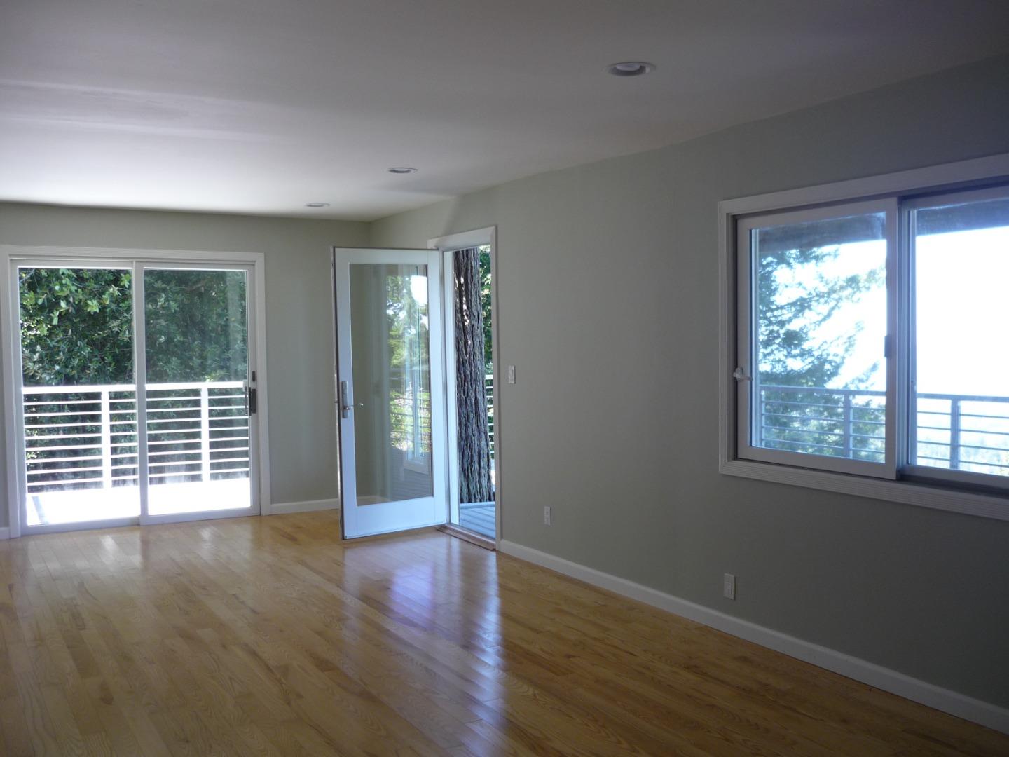 254 Swett Road Woodside, CA 94062 - Photo 11 of 24 a view of an empty room with wooden floor and a window