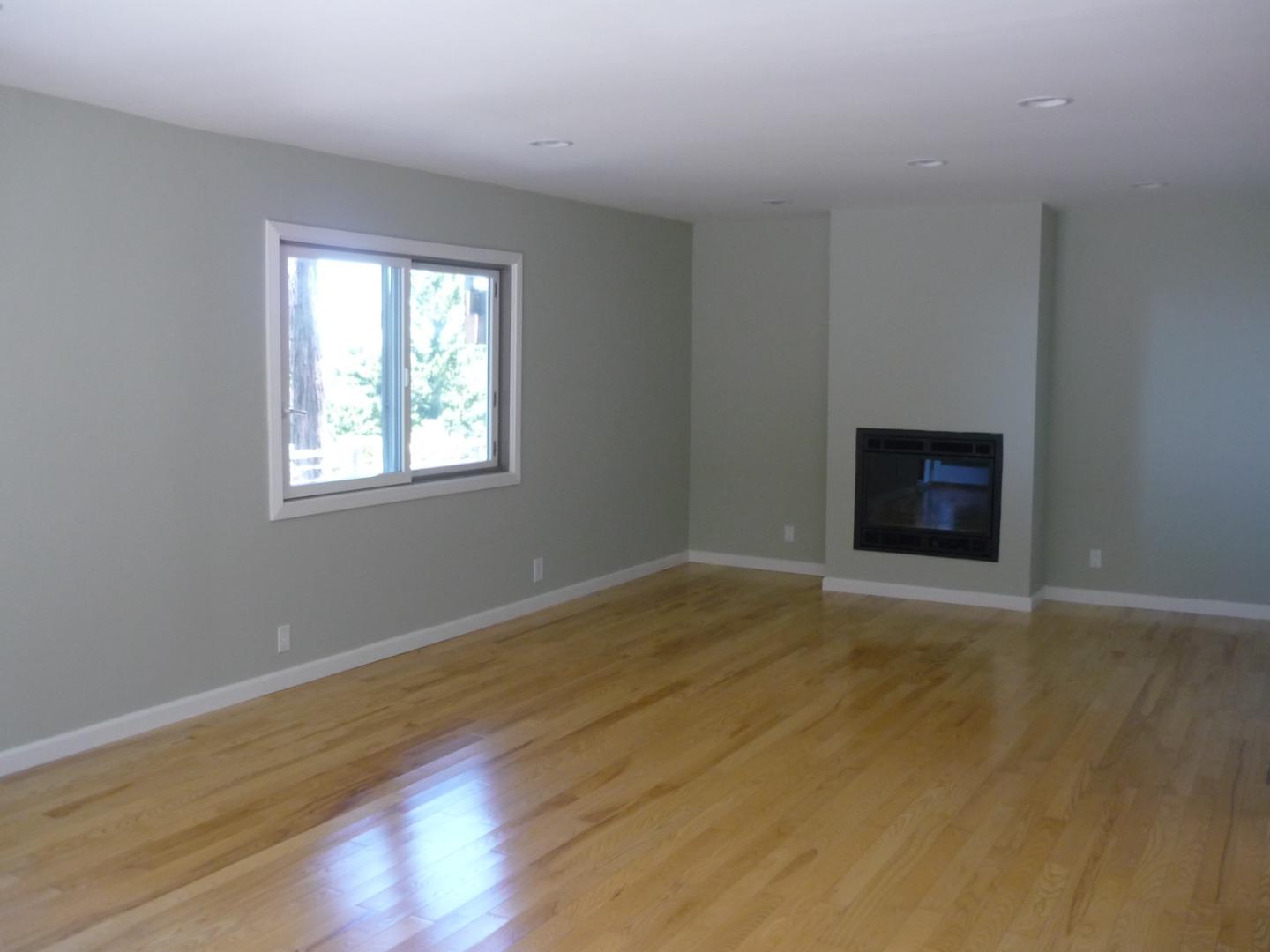 254 Swett Road Woodside, CA 94062 - Photo 12 of 24 a view of an empty room with wooden floor and a window