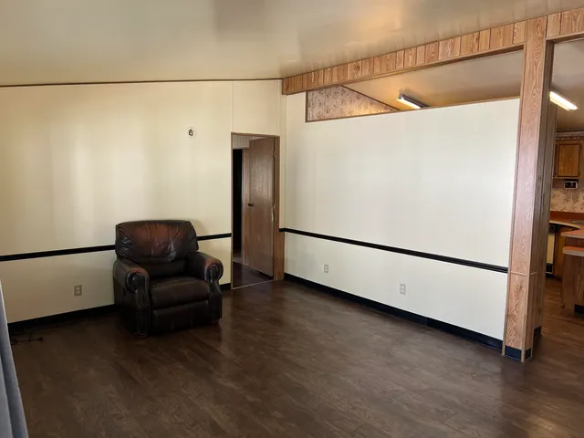 a view of a storage & utility room with wooden floor