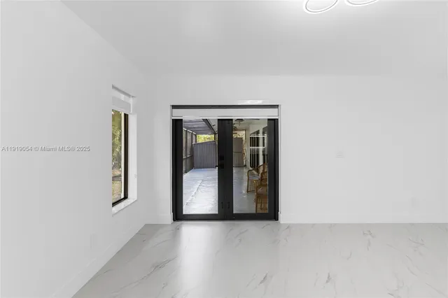 a view of an empty room with window