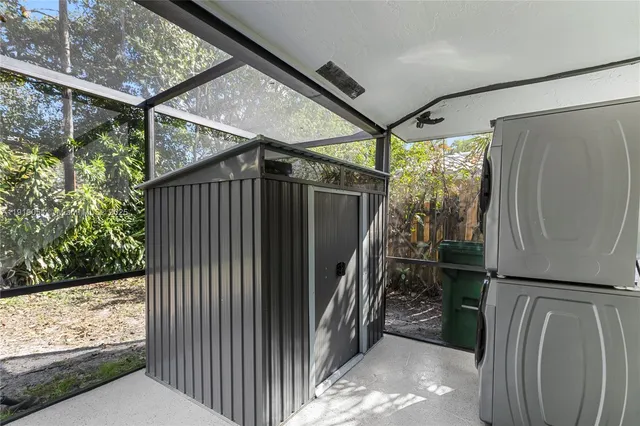 a view of entryway with wooden floor and a shower