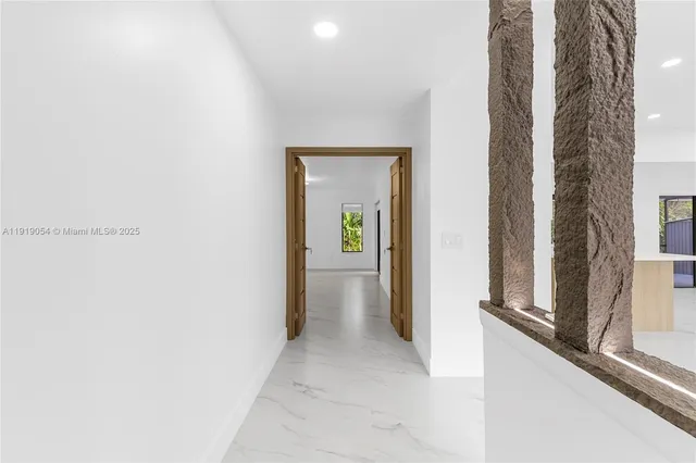 a view of a hallway with windows