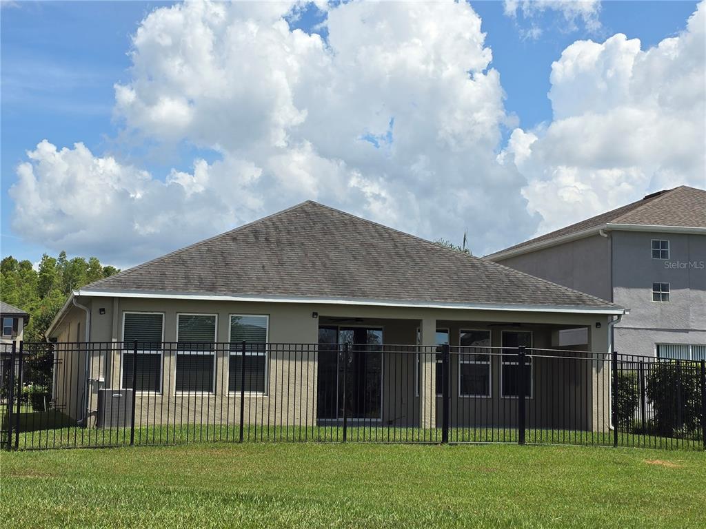 30517 Pecan Valley Loop Wesley Chapel, FL 33543 - Photo 11 of 15 a front view of a house with a yard