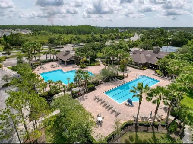 a view of sign board with flower around