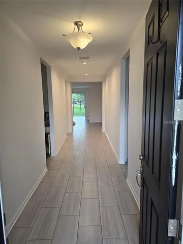 wooden floor in a hall with an entryway