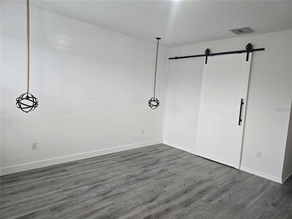 30517 Pecan Valley Loop Wesley Chapel, FL 33543 - Photo 7 of 15 a view of a room with wooden floor