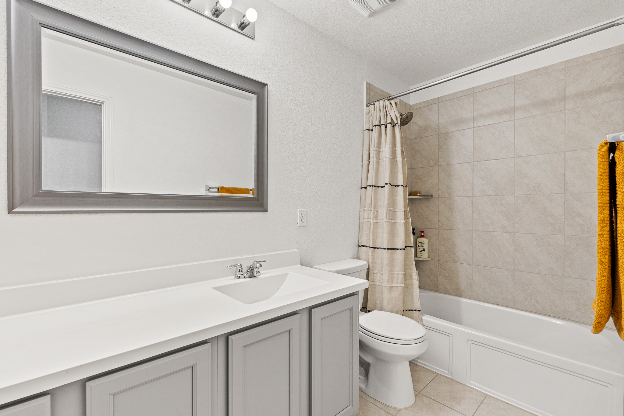136 Copper Lane Kyle, TX 78640 - Photo 28 of 33 a bathroom with a sink a toilet and shower