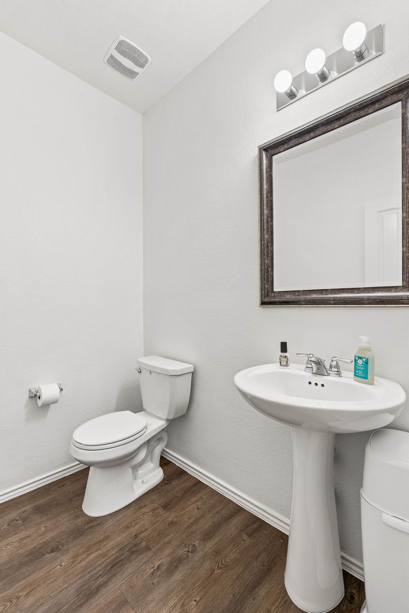 136 Copper Lane Kyle, TX 78640 - Photo 10 of 33 a bathroom with a toilet sink and mirror