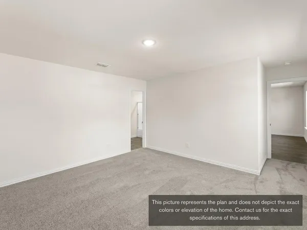an empty room with wooden floor and window