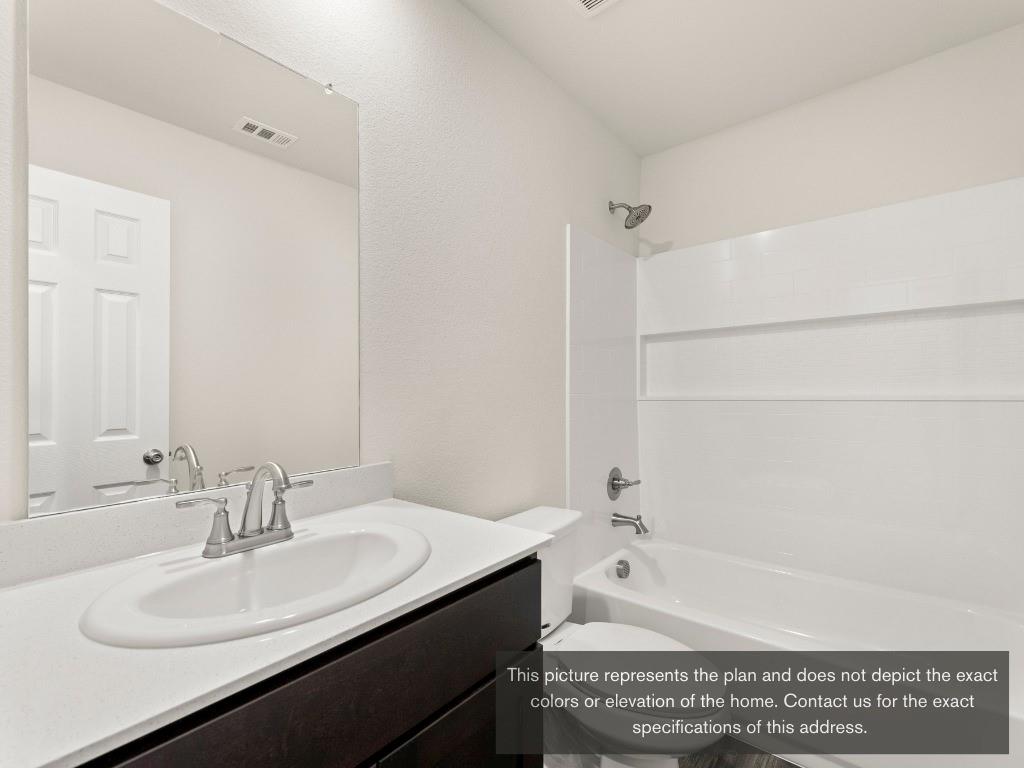 11433 Themis Court Lorena, TX 76655 - Photo 3 of 22 a bathroom with a granite countertop bathtub sink and mirror