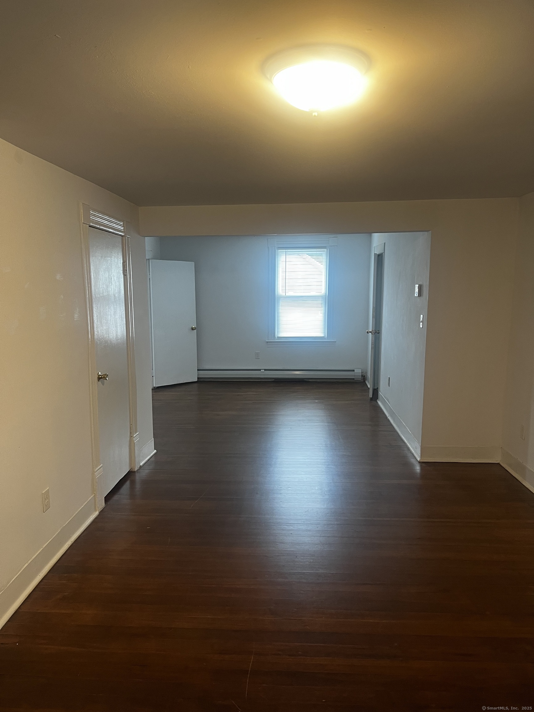 1 Farnsworth Street, Unit 2 New London, CT 06320 - Photo 11 of 21 an empty room with wooden floor and windows