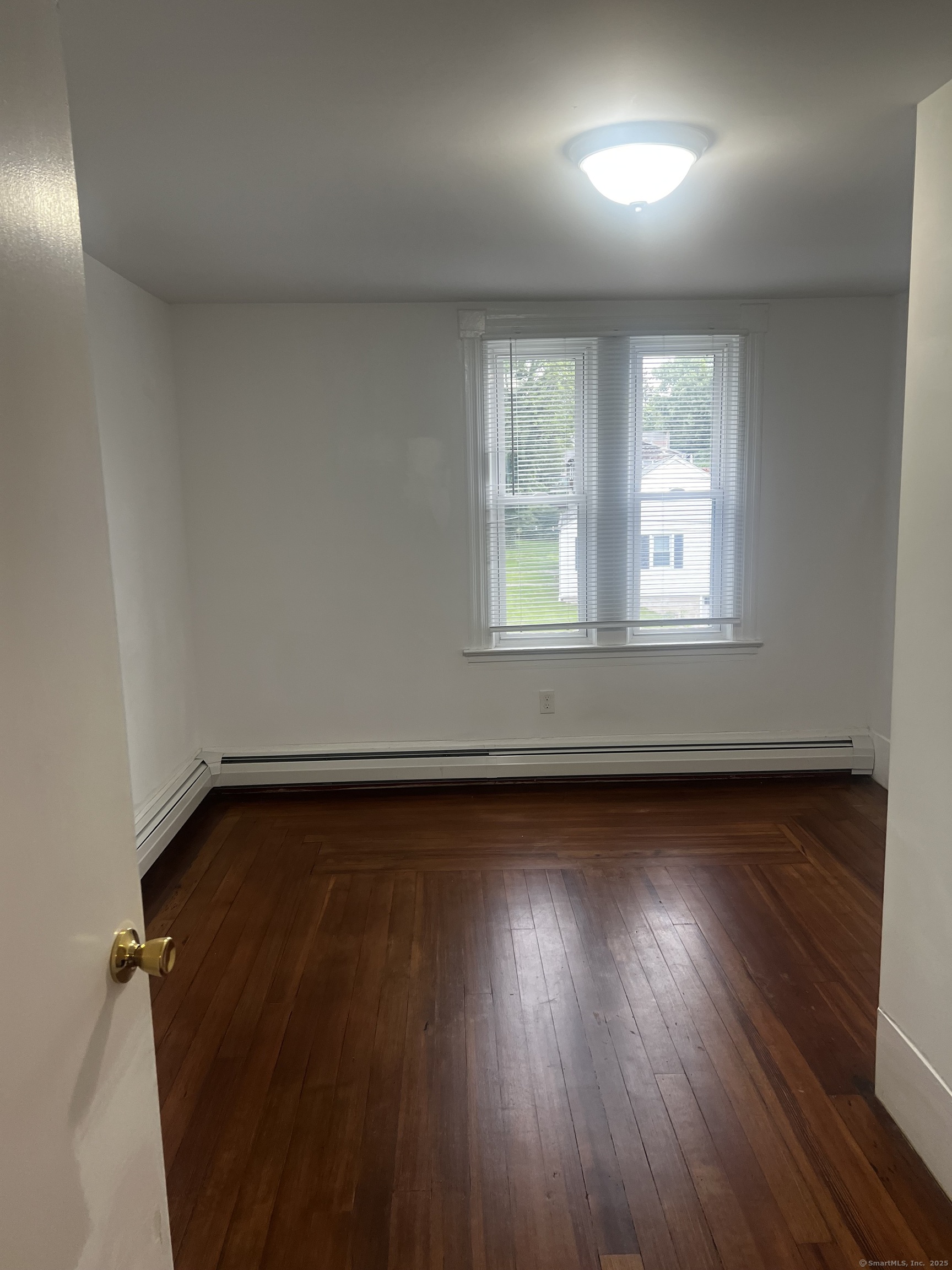 1 Farnsworth Street, Unit 2 New London, CT 06320 - Photo 13 of 21 an empty room with wooden floor and windows