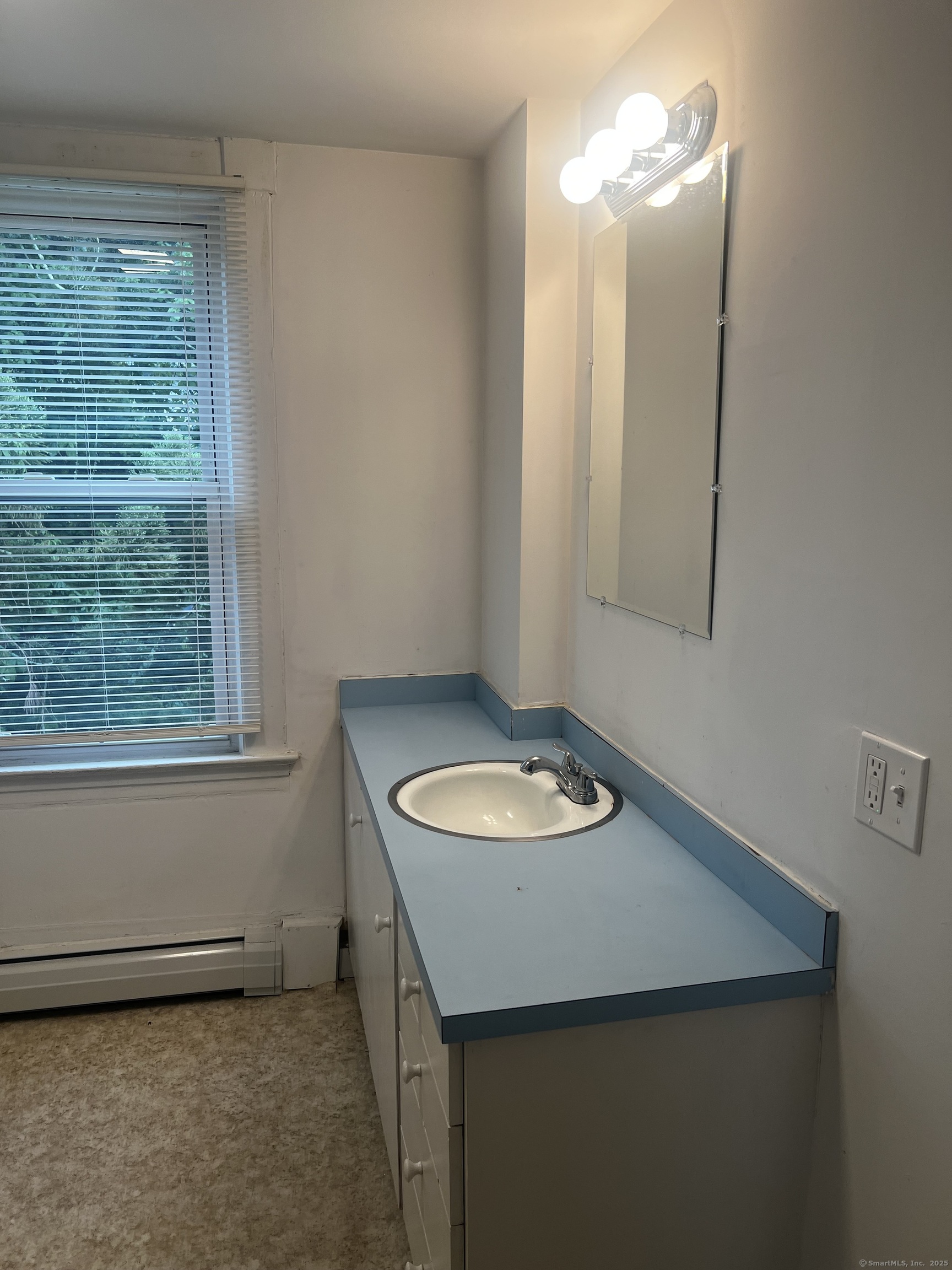 1 Farnsworth Street, Unit 2 New London, CT 06320 - Photo 16 of 21 a bathroom with a sink a mirror and a window