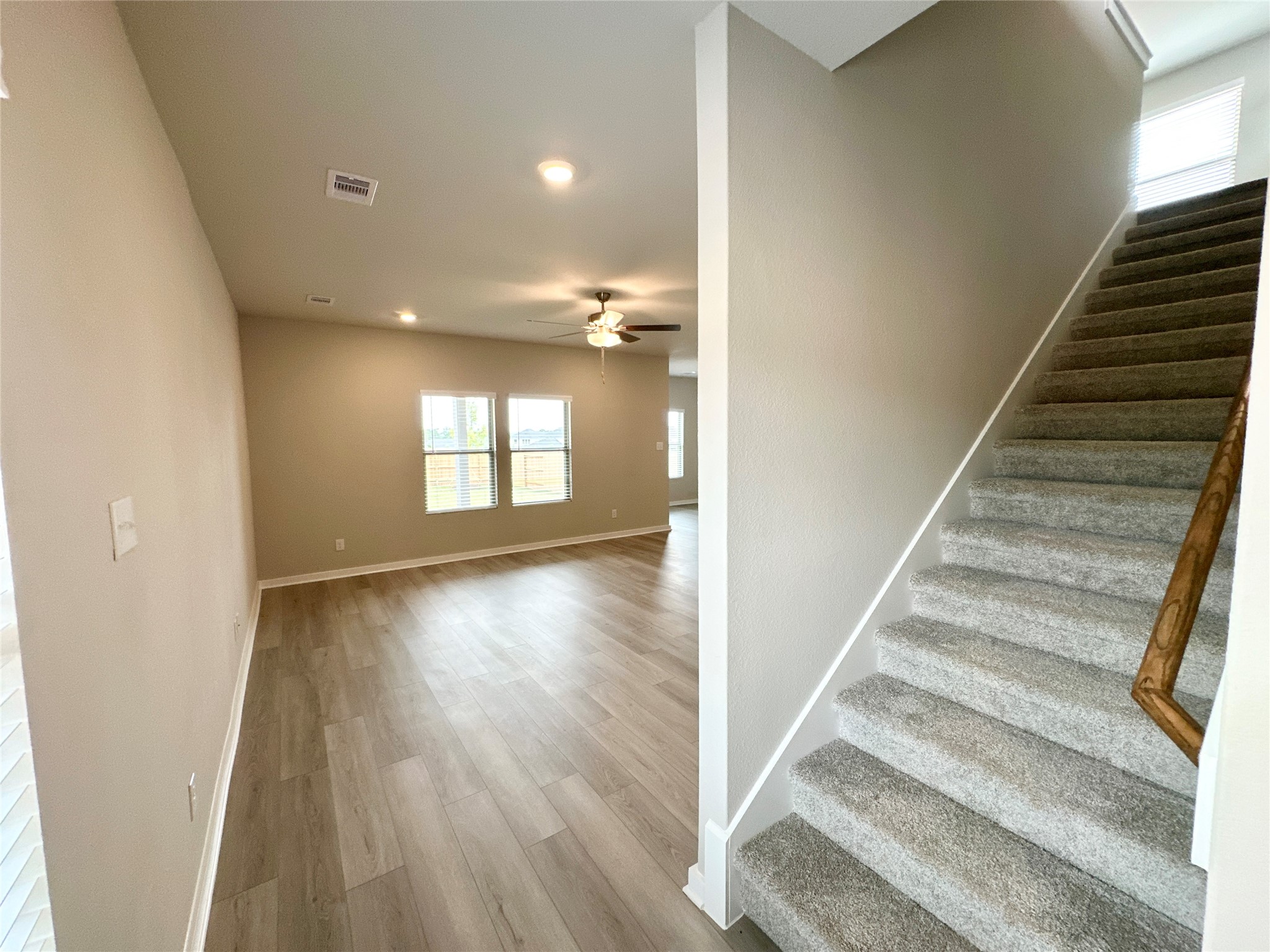 12198 Ridge Top Drive Conroe, TX 77304 - Photo 5 of 27 a view of an entryway with wooden floor and stairs