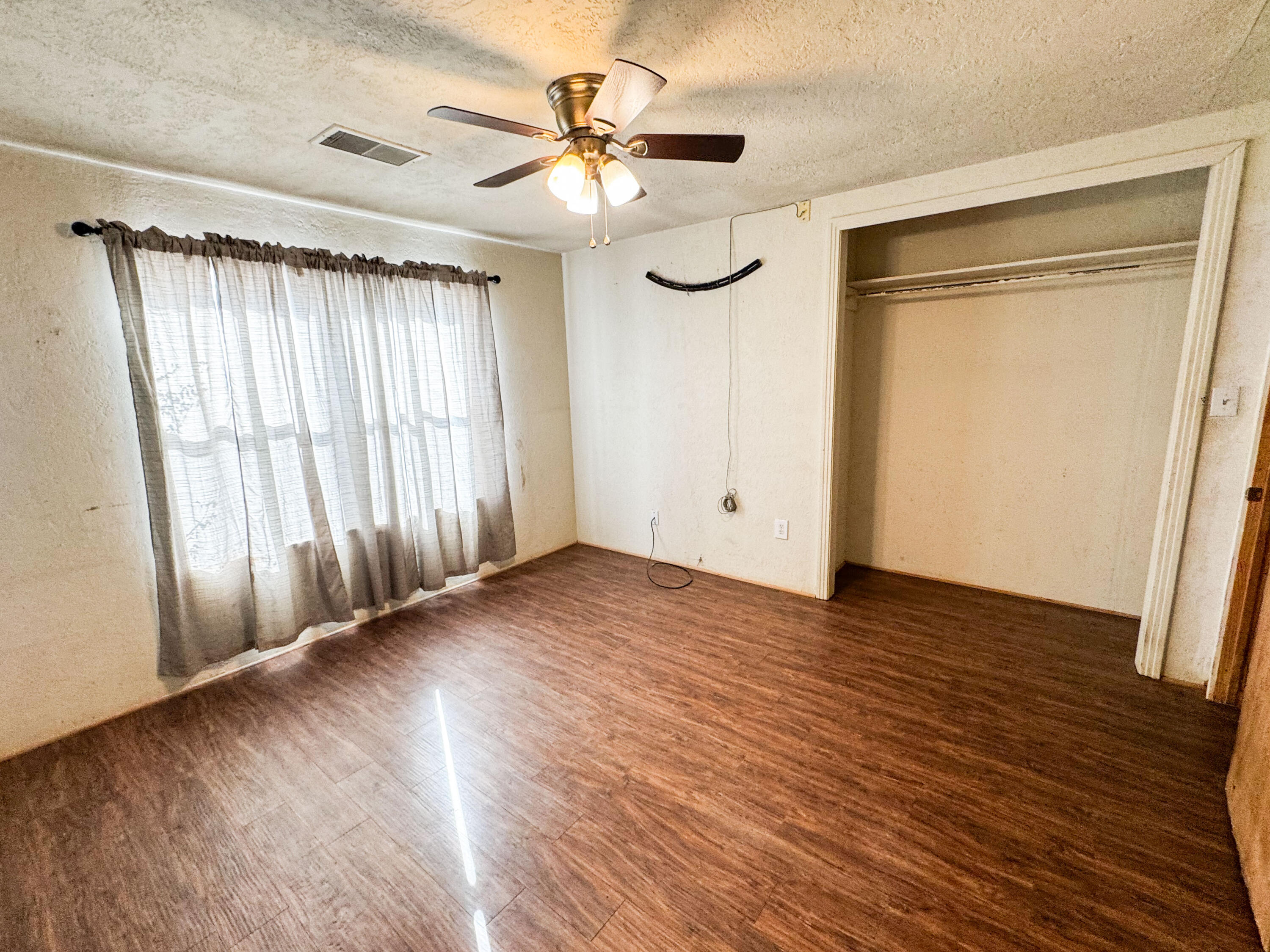 733 East 13th Street Littlefield, TX 79339 - Photo 8 of 15 a view of entryway with wooden floor